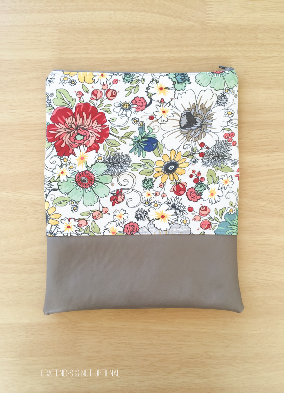 floral and leather foldover clutch